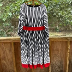 Elegant Black and White Polka Dot Dress with Red Accents